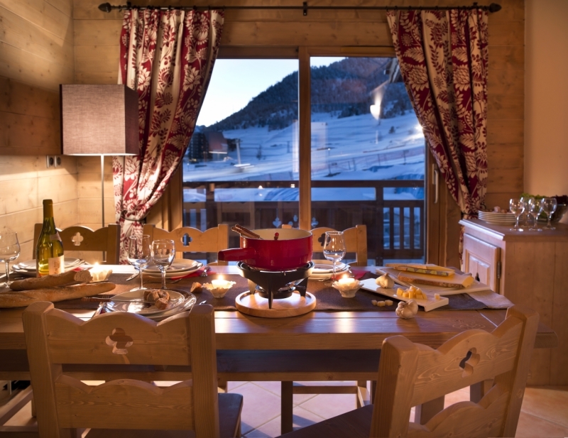 An artist's impression of an example of a dining room in a Three Bedroom Apartment in L'Oree des Neiges, Vallandry, France