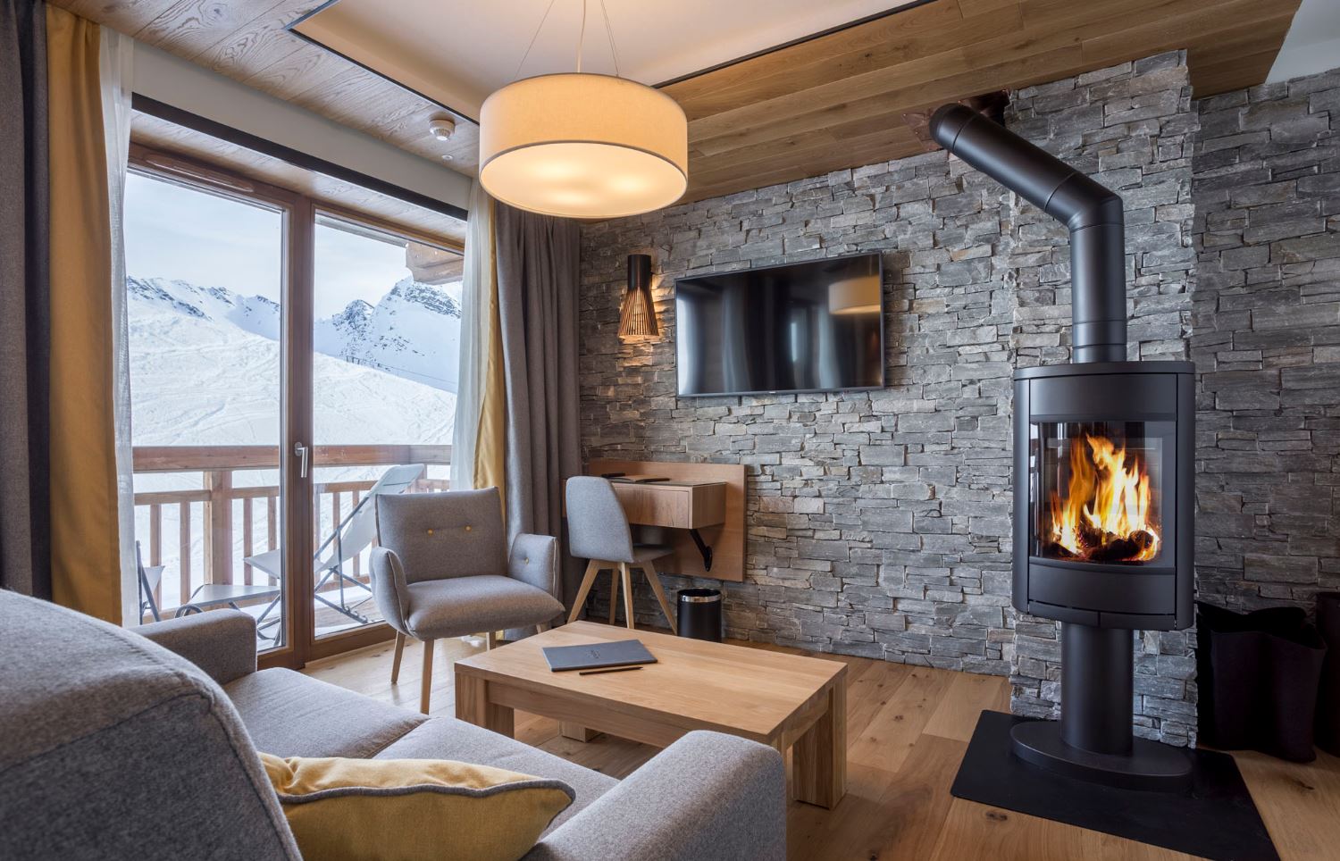 Alparena Junior Suite lounge with fireplace